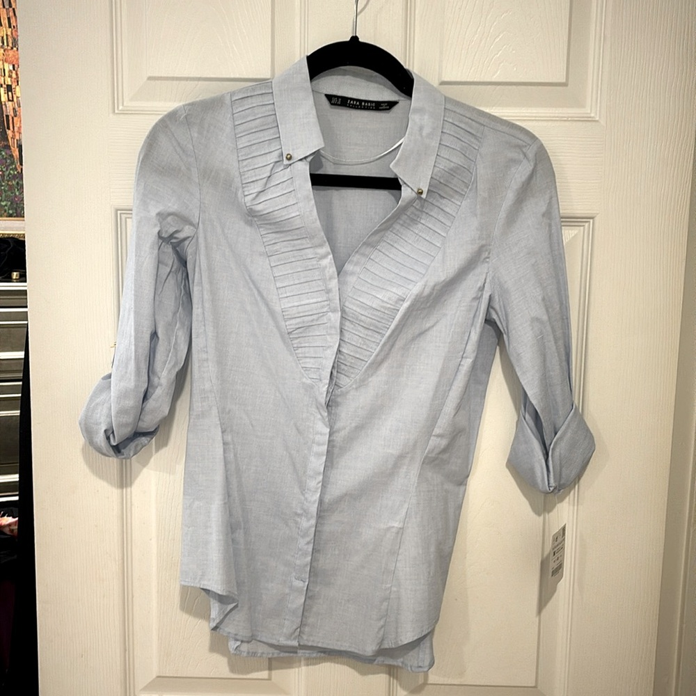 Zara baby blue button down shirt.  Never been worn